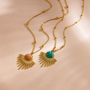 Vintage gold feather pendant necklaces with sunburst stones in pink and turquoise