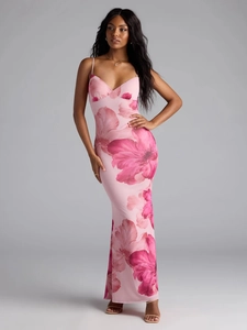 Detail of V-neckline and large floral print on a slim fit pink backless maxi dress