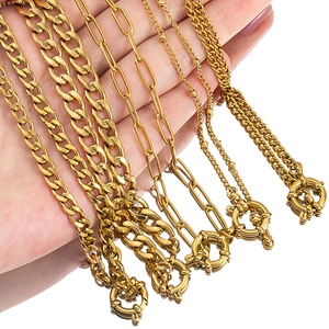 Various styles of gold stainless steel chains with lobster clasps on white background