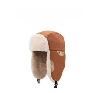 Detail of brown trapper hat with white faux fur lining and adjustable chin strap buckles
