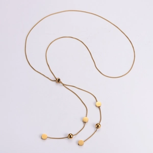 Detail of adjustable gold-plated stainless steel tassel necklace with round metal charms