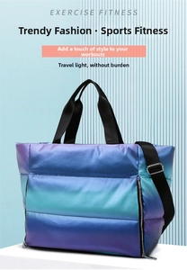 Detailed view of purple gradient quilted fitness bag with adjustable strap and handles