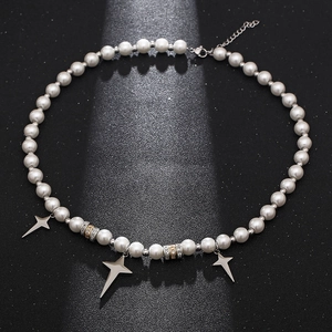 Hip-hop pearl necklace with silver star pendants and metallic accents on dark texture