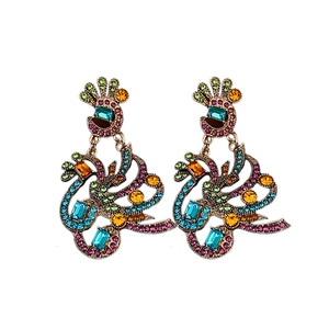 Vintage gold peacock earrings with vibrant multicolored rhinestones on a white backdrop