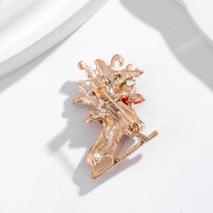 Back view of gold-plated Christmas boot brooch showing the secure pin fastener