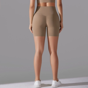 Detail view of high waist yoga shorts with butt lifting seams in dark coffee color