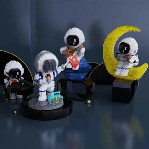 Astronaut building block pen holders in piano, guitar, violin and flag styles