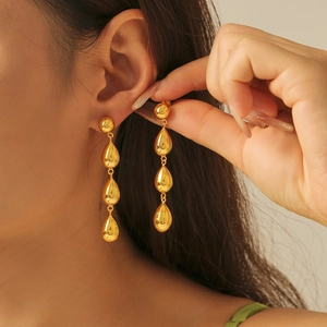 Elegant triple-drop geometric tassel earrings in 18k gold plated copper finish