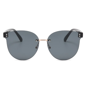 Frameless cat-eye sunglasses with grey gradient lenses and black-gold metal bridge