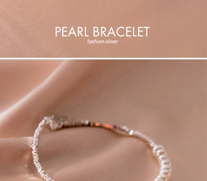 Detailed close-up of s925 silver pearl bracelet on luxurious pink silk fabric texture