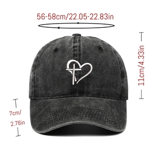 Detail view of washed denim baseball cap with cross heart embroidery and sizing data