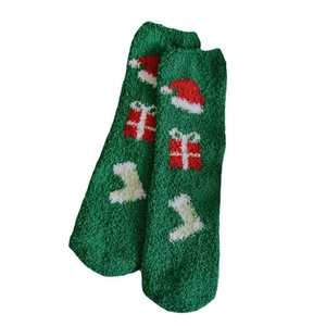 Thick green coral fleece Christmas socks with festive knit patterns and warm plush texture