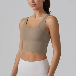 Detailed close-up of earth-toned yoga bra with wide shoulder straps and U-neckline