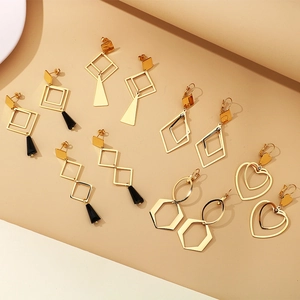Parure de boucles d'oreilles géométriques en acier doré avec pendentifs losanges