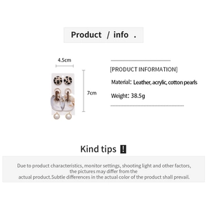 Detail view of acrylic, leather and pearl earrings with weight and size specifications