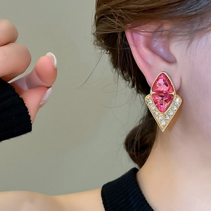 Vintage geometric diamond-shaped pink gemstone stud earrings with a gold metal frame