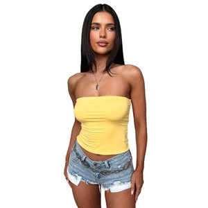 Front view of yellow strapless knit tube top paired with denim shorts for summer style