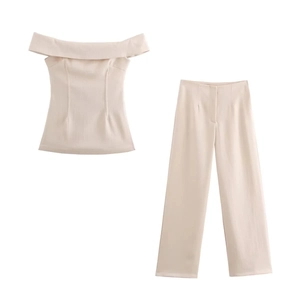 Beige two-piece off-shoulder crop top and wide-leg trousers set in textured fabric