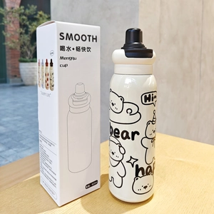 Detail of 620ml white cartoon bear vacuum flask with packaging box on wooden table