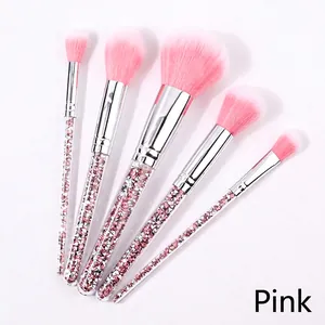 Detailed view of pink glitter handles and gradient bristles on a 5-piece makeup brush set