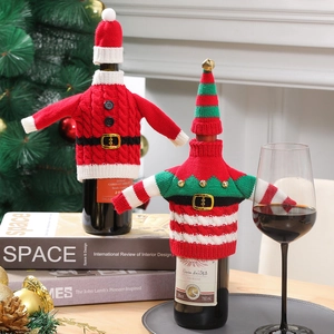 Knitted Christmas wine bottle covers with Santa and Elf designs for holiday table decor