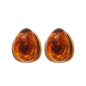Elegant amber resin teardrop earrings with gold metal base and marble texture on white
