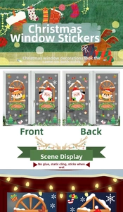 Detail of static Christmas window stickers showing Santa Claus and reindeer on glass surface
