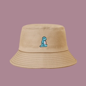 Close-up of cute blue dinosaur embroidery on khaki cotton wide brim bucket hat