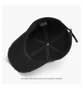 Internal view of black cotton baseball cap showing 6-panel structure and distressed brim
