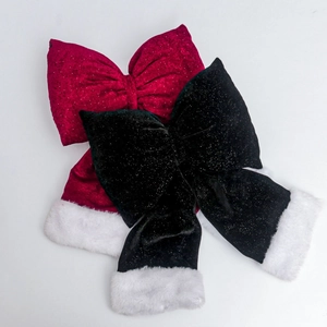 Detail of red and black velvet Christmas bows with sequins and white faux fur trim