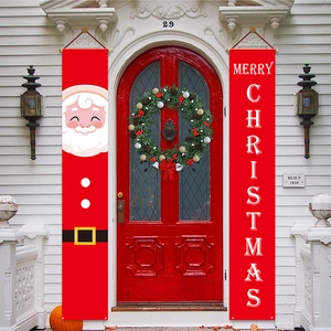 Outdoor scene of Merry Christmas door banners with Santa Claus on a red home entrance