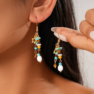 Bohemian star earrings with colorful glass beads and turquoise stones on gold hooks
