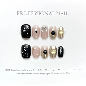 Handmade almond press-on nails set with black graffiti and golden mirror finish art