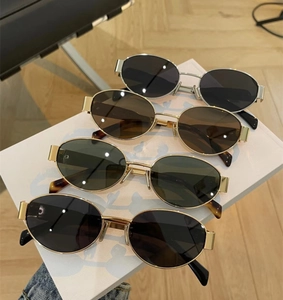 Detailed view of four retro oval metal sunglasses with multi-color lenses and frames
