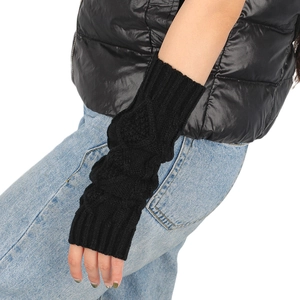 Detail of black cable knit arm warmer showing textured pattern and fingerless design