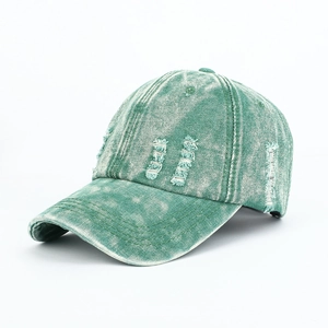 Vintage washed green denim baseball cap with distressed details and retro street style