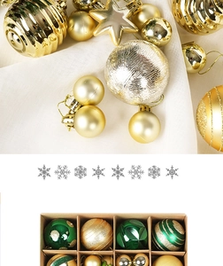 Close-up of assorted gold, green, and silver Christmas balls with matte and glitter finishes