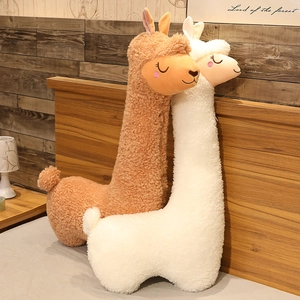 Soft texture detail of cute white and brown cartoon alpaca plush toy skin shells