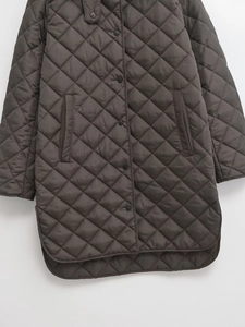 Quilted longline jacket in charcoal grey featuring classic diamond stitch and snap buttons