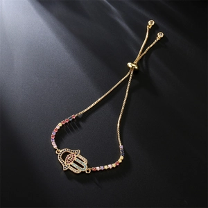 Detail of Hamsa Hand gold bracelet with colorful CZ stones and bolo sliding clasp