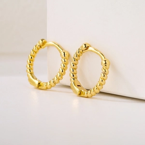 Minimalist gold-plated twisted rope hoop earrings with zircon on white pedestals
