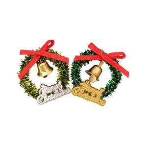 Miniature dollhouse Christmas wreaths with gold bells and Merry Christmas signs