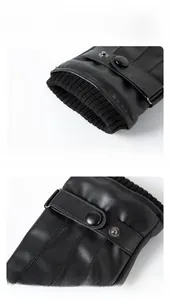 Close-up of black PU leather glove with knitted cuffs and adjustable snap buckle strap