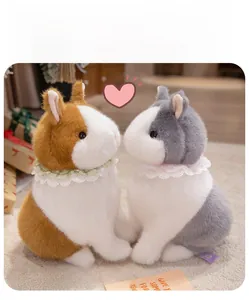Detail of plush bunny pair in grey and brown with lace collars and soft faux fur texture