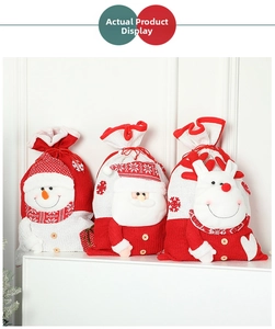 Detailed view of knitted Christmas drawstring bags with 3D Santa, Snowman and Reindeer motifs