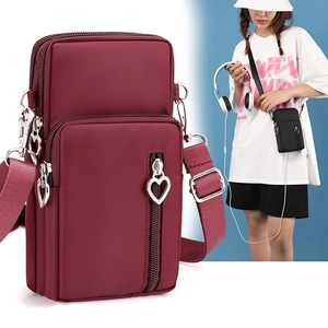 Three-layer wine red crossbody phone bag with heart zipper detail and adjustable strap