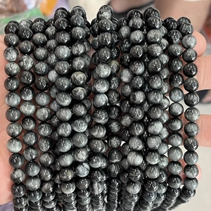 Natural hawk eye stone round beads for DIY jewelry making shown in hand display