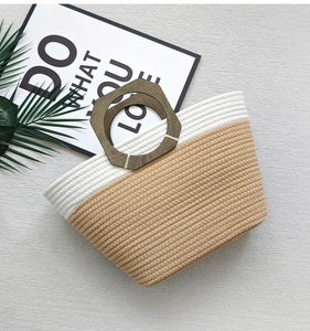 Minimalist cotton rope woven bag in beige and light brown with dark wood handles