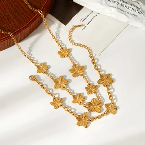 Elegant gold five-petal flower necklace with brushed texture and adjustable lobster clasp