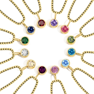 Set of 12 gold birthstone pendants with sparkling round crystals on box chains